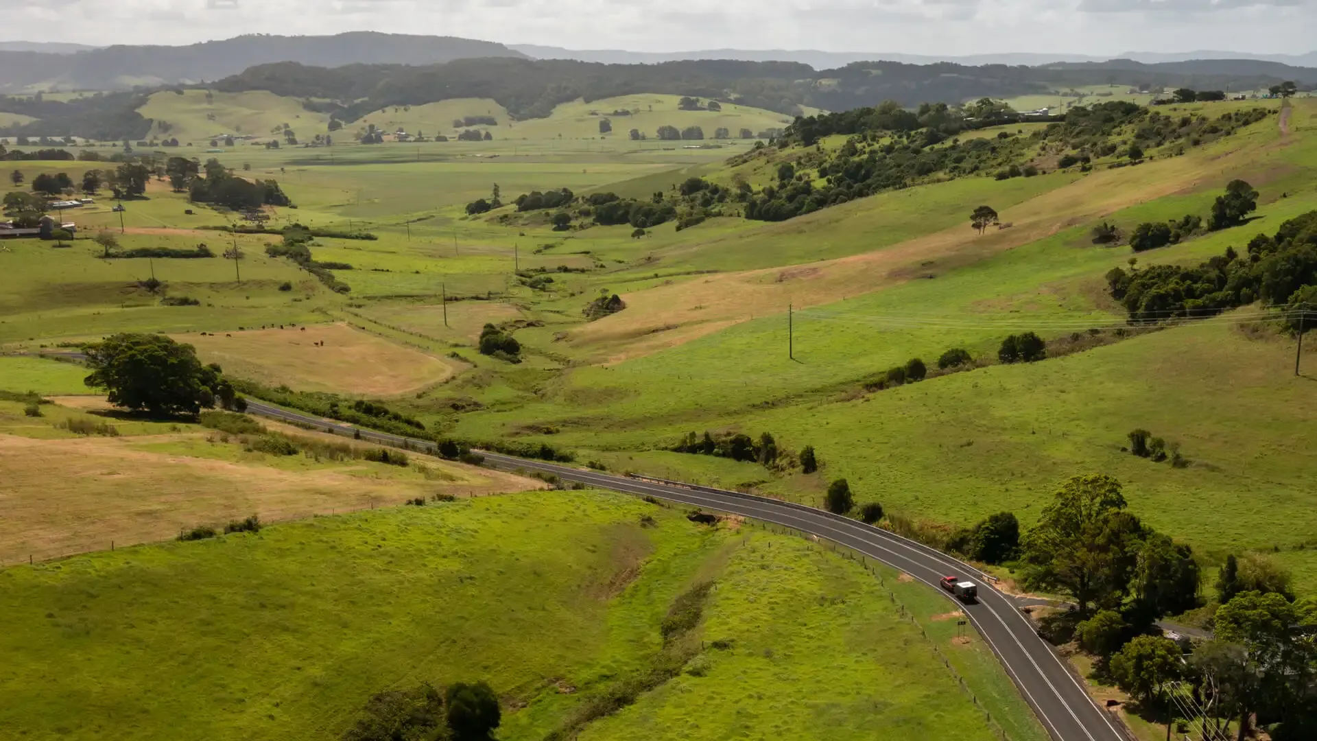 Musso towing caravan through the countryside
